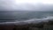 Wide Shot Of Waves On Foggy Beach