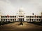 Wide shot of the white building of the Lalitha Mahal Palace Hotel in India