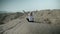 Wide shot of woman enjoying sunshine in Safari landscape