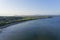 The wide, sweeping Llanbedrog beach in Cardigan Bay on a summer evening