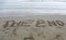 Wide text THE END on the beach