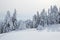 The wide trail leads to the snowy igloo. Winter mountain landscapes. Location place the Carpathian Mountains, Ukraine, Europe