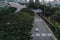 Wide urban freeway Asian metropolis. Modern buildings and structures. Singapore. Highway in dense rainforest