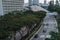 Wide urban freeway Asian metropolis. Modern buildings and structures. Singapore. Highway in dense rainforest