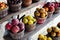 Wide variety of homegrown fruits on wooden basket and shelves at roadside market stand in Santa Rosa, Destin, Florid, fresh picked