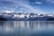 Wide view of Alaska Glacier bay landscape during late summer with ship going very close to the coastline