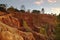 Wide view of the cliffs, pine trees and sky