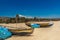 Wide view of fishing boats parked alone in seashore with tress and mountain in the background, Visakhapatnam, India March 05 2017