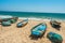 Wide view of group of fishing boats parked in seashore with people in the background, Visakhapatnam, Andhra Pradesh, March 05 2017