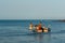 Wide view of group of people travelling on water boats and water scooter, Visakhapatnam, Andhra Pradesh, March 05 2017