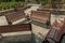 Wide view of group of unoccupied wooden seats or chairs arranged in a garden or park, Chennai, India, April 1st 2017