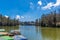 Wide view of lake with boats, beautiful tress in the background, Ooty, India, 19 Aug 2016