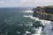 Wide view of O\' Briens Tower atop Cliffs of Moher