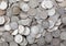 Wide view of old silver dimes illuminated with natural light