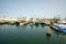 Wide view of the pier and fishing boats of the Point Judith harbor in Rhode