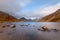 Wide vista view of remote lake Wastwater with dramatic sky. Lake District, UK.