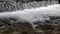 Wide waterfall on a mountain river in dark summer day Foamed water Falling waterfall