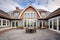 wideangle shot, luxury gambrel abode, shingle patterns