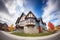 wideangle shot of tudor and modern architecture in harmony