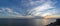 widescreen panorama of the skyline, sunrise sunset on the black sea, sky with beautiful clouds, seascape