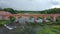 The widest waterfall in Europe in Latvia Kuldiga and brick bridge across the river Venta areal dron shot.