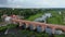 The widest waterfall in Europe in Latvia Kuldiga and brick bridge across the river venta areal dron shot.