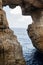 Wied il Mielah canyon, natural arch over the sea. Gozo, Malta