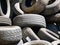 Wien/Austria - june 4 2019: close up of a group of old auto tyres inside a container to be send to a recycling plant in vienna