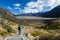 Wiew from Tasman Glacier walk with blue person in Mount Cook National Park, Aoraki, South Island, New Zealand