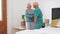 Wife, help or old husband in bedroom care mobility walk, comfort or marriage. Senior partnership, woman and wake up