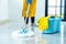 Wife housekeeping and cleaning concept, Happy young woman in blue rubber gloves wiping dust using mop while cleaning on floor at