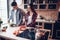 Wife and husband cooking vegetable salad in bowl