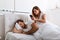 Wife secretly watches the husband`s phone while the husband sleep. The wife is spying on her husband`s phone while he sleeps. Th