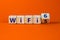 WiFi 5 or 6 symbol. Turned a wooden cube and changed the words WiFi 5 to WiFi 6. Beautiful orange background, copy space. Business
