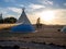 Wigwam in a camp in a field