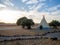 Wigwam in a camp in a field