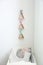 Wigwam shaped shelves over crib in baby room. Interior