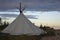 Wigwam tent in the North in summer with sky