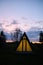 Wigwams against the sunset sky. A hause