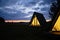 Wigwams against the sunset sky. A hause