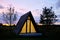 Wigwams against the sunset sky. A hause