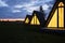 Wigwams against the sunset sky. A hause