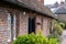 Wilbraham`s Almshouses in Hadley Green, High Barnet, North London UK. Cottages are built of red brick and have red roof tiles