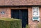 Wilbraham`s Almshouses in Hadley Green, High Barnet, North London UK. Cottages are built of red brick and have red roof tiles