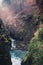 Wilczki Waterfall, riverbed between the rocks richly covered with vegetation