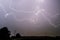 Wild aerial lightning in a slow moving thunderstorm.