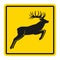 Wild animals yellow road sign. Silhouette of jumping deer