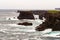 The wild Atlantic Ocean crashes against the sea stacks, rocks, a
