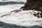 The wild Atlantic Ocean crashes against the sea stacks, rocks, and coastline
