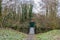 Wild autumn vegetation, a path to a footbridge over a stream and closed gate at the end surrounded, staircase to Stein Castle